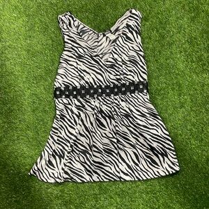 Sleeveless satin zebra striped blouse with rhinestone empire waist detail.